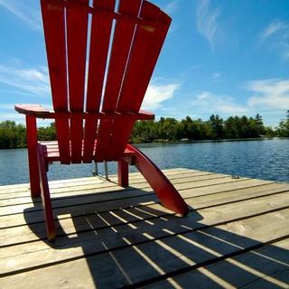 Christie's Mill Inn and Spa | Port Severn, Ontario | Red Muskoka chair on dock