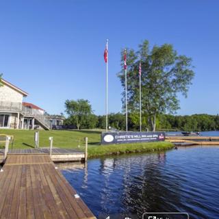 Christie's Mill Inn and Spa | Port Severn, Ontario | Lake and dock beside front of hotel