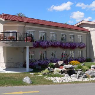 Christie's Mill Inn and Spa | Port Severn, Ontario | Exterior of Christie's Mill with garden