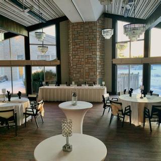 Christie's Mill Inn and Spa | Port Severn, Ontario | Table and chairs with white tablecloth and glass chandeliers 