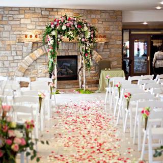 Christie's Mill Inn and Spa | Port Severn, Ontario | Venue with stone wall and flower petals on floor