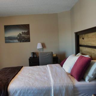 Christie's Mill Inn and Spa | Port Severn, Ontario | Queen bedroom with work desk and TV